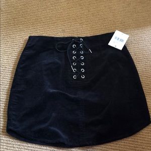 Black corduroy skirt with lace up detail